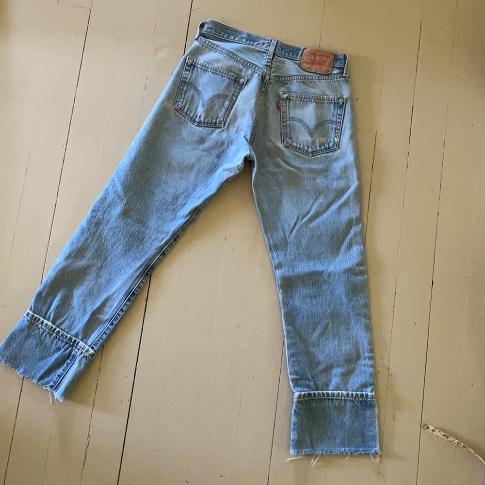 Distressed Light wash Levis 501s